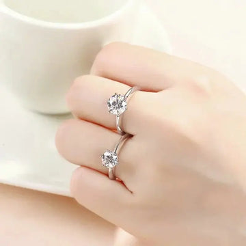 3 CT Moissanite Solitaire Ring with dainty, elegant design and brilliant moissanite stone on hand.